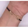 Pozłacana bransoletka Czarny sznurek PIÓRKO