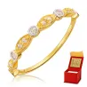 Pierścionek delikatny złoty białe kamienie
